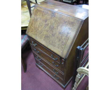 A Burr Walnut Bureau, fall front over brushing slides and four drawers, bracket feet.