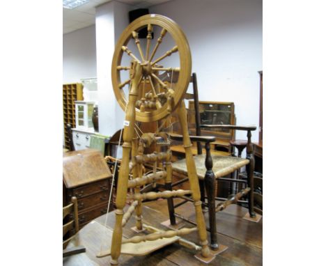 A Late XX Century Light Oak Spinning Wheel, 53cm wheel diameter, ring turned tripod and stretchered legs, overall height 129c