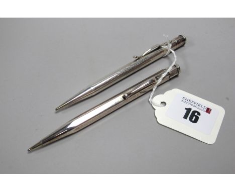 A Hallmarked Silver Yard-O-Led Pencil, London 1948; Another Example, London 1947, allover engine turned decoration. (2) 