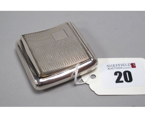 A Hallmarked Silver Snuff Box, C&amp;S, Chester 1929, of rounded square bowed design, allover engine turned (35grams). 