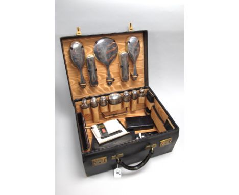 J. W. Benson Ltd Ludgate Hill London; A c.Early XX Century Travelling Case, fitted to the watered silk interior with assorted