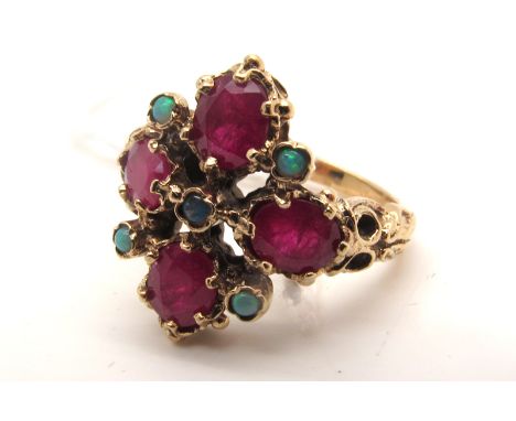 A 9ct Gold Victorian Style Cluster Dress Ring, oval claw set with opal set highlights, between textured shoulders (finger siz