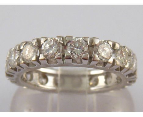 A fine 18 carat white gold diamond eternity ring by Recarlo, the stones of very good clarity and with documents stating the t