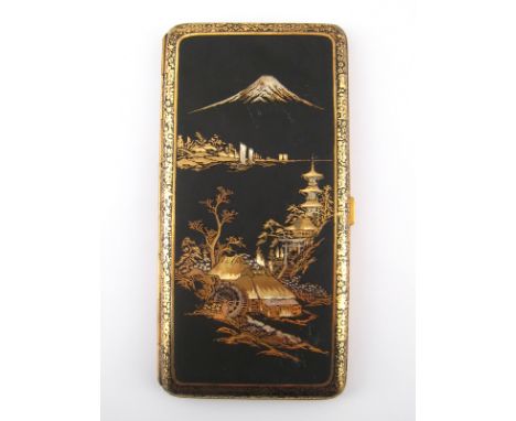 A long cigarette case, the matt black surface with yellow and white metal inlay of Japanese scenes. 