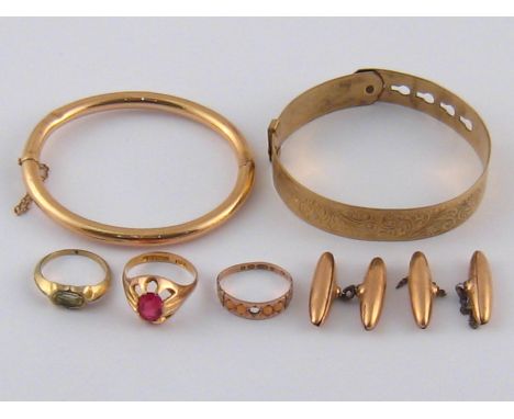 A mixed lot comprising a yellow metal (tests 9 carat gold) bangle, 10.2 gms, three 9 carat gold rings, 6.2 gms, a 9ct gold ba