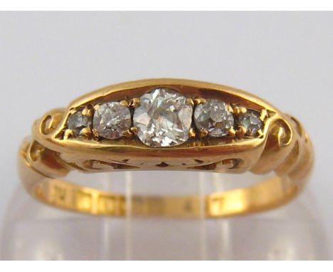 An antique 18 carat gold five stone old brilliant cut diamond ring, centre stone approx 3.5mm diameter, estimated total diamo