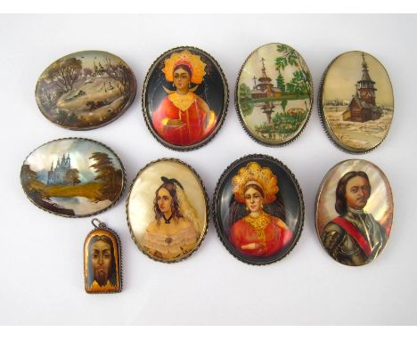 Six Soviet Russian brooches on m.o.p., two lacquered brooches and a pendant enamel icon, all with white metal mounts. 