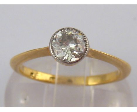 A yellow metal (tests 18 carat gold) diamond solitaire ring, the old brilliant cut diamond measuring approx 5.1 x3mm deep, es