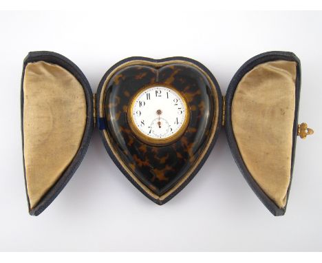 A gilt metal and tortoiseshell heart shape travelling clock, in original fitted case, circa 1900, approx 9 x8cm, in need of r