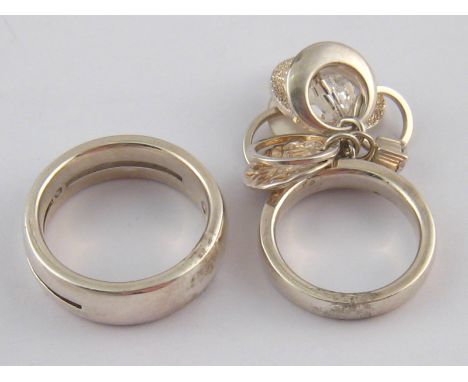 Two white metal (tests silver) rings by Fossil.
