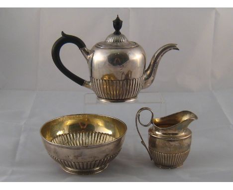 A Russian three piece silver teaset comprising teapot with urn finial, jug and large basin, workmaster A.Y. (cyrillics), St P