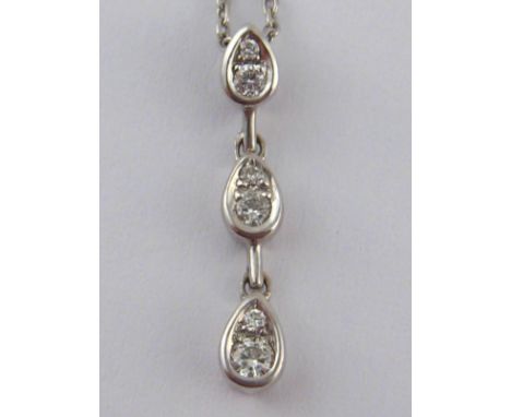 A white metal (tests 18 carat gold) diamond pendant necklace, pendant approx 2cm, chain approx 42cm, 2.3 gms.
