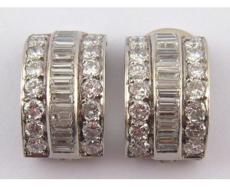 A pair of Art Deco style round brilliant and baguette cut diamond ear clips, estimated total diamond content approx 2 carats,