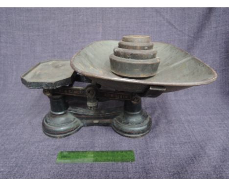 A set of vintage cast metal Avery weighing scales and weights
