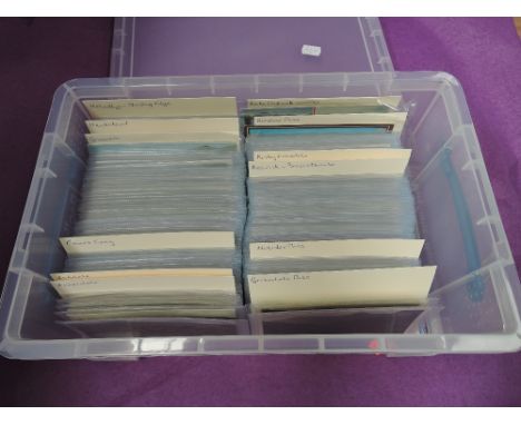 A plastic box containing approximately 500 vintage postcards of mainly Cumbria
