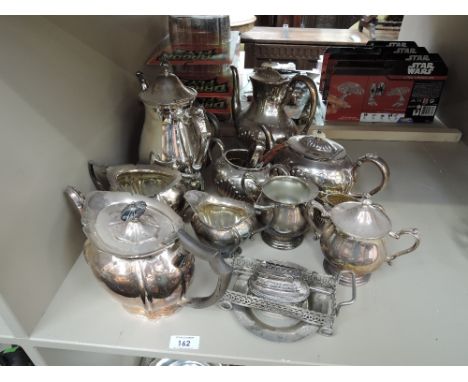 A selection of silver plate including tea sets, table lighter etc