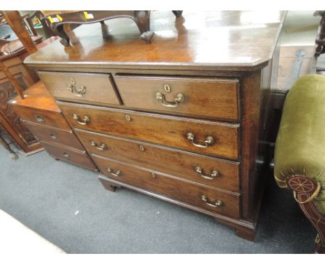 An 18th century oak chest of 2 short and 3 long graduated drawers on later bracket feet