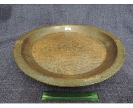 A vintage treen platter of circular form
