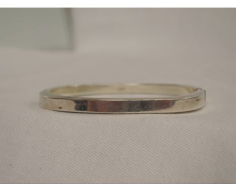 An HM silver hinged bangle of plain shaped angular form