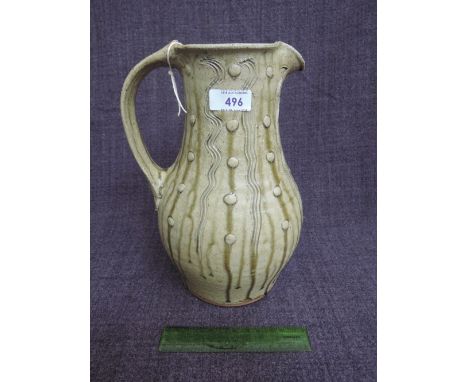 A Studio Pottery jug by Jim Malone of Sgraffito and nuka drip glaze form with JM mark and A for Ainstable