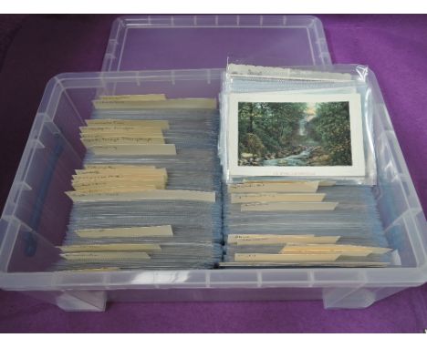 A plastic box containing approximately 600 plus vintage postcards of Wales, in sleeves