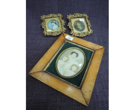 A pair of 19th century oval miniature in gilt plaster frames and a 19th century oval portrait study in birds eye maple frame
