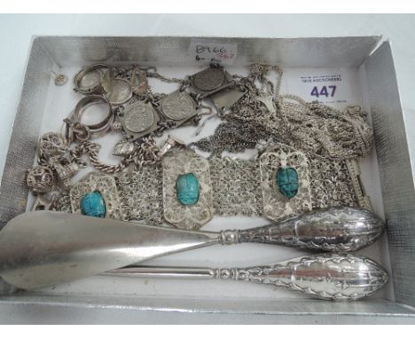 A selection of white metal jewellery including coin bracelet and earrings, charm bracelet, rings etc and an HM silver handled