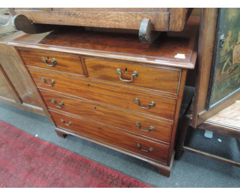 An early 19thc entury mahjogany chest of two short and three long cockbeaded drawers on bracket feet