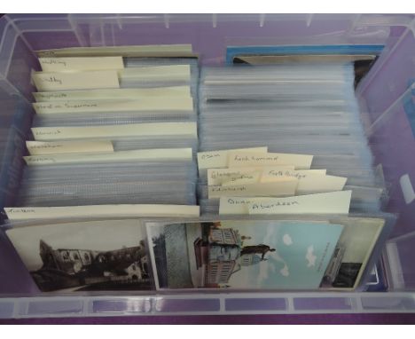 A plastic box containing approximately 200 English and 200 Scottish vintage postcards in sleeves, including Whitby, York, War