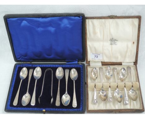 A cased set of six Edwardian silver teaspoons with matching sugar nips having engraved floral decoration and monogrammed cart