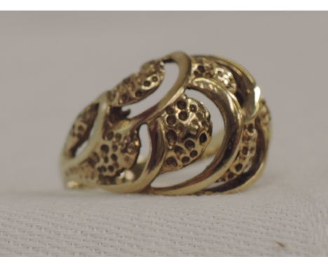A lady's 9ct gold dress ring having open shell style decoration,  size O