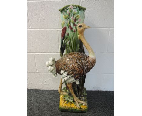 An early 20th century vintage majolica stickstand modelled as a standing ostrich against a naturalistic trunkHeight 33", dama
