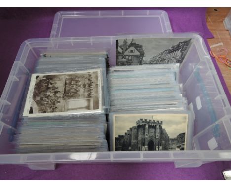 A plastic box containing approximately 450 vintage postcards in sleeves, topographical interest