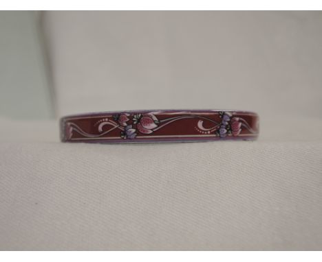 A pink and lilac floral enamelled bangle by Michaela Frey of Austria