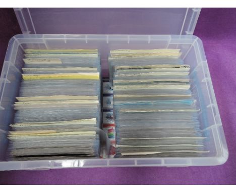 A plastic box containing approximately 600 vintage postcards of towns including Manchester, Liverpool, Oxford, Nottingham and