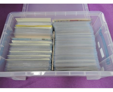 A plastic box containing approximately 600 vintage postcards in sleeves, approximately half London and half various towns and