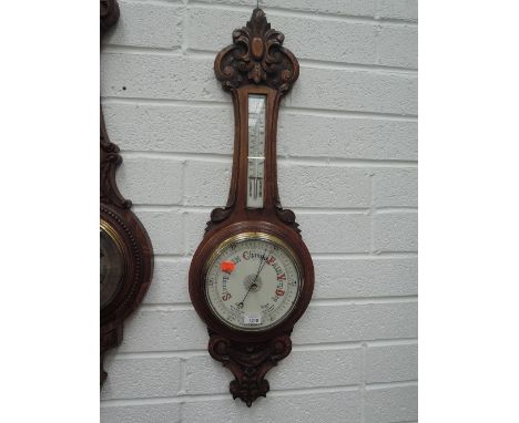 An early 20th century oak aneroid banjo case barometer having thermometer scale