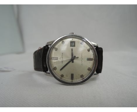 A gents vintage Helvetia automatic wrist watch, no 8601, having a baton dial with date aperture to circular face on a brown l