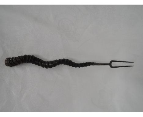 A 19th century two pronged white metal toasting fork with twisted antelope horn handle, no marks tested as silver