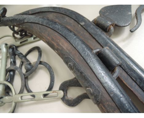 A pair of vintage horse hames and later bits