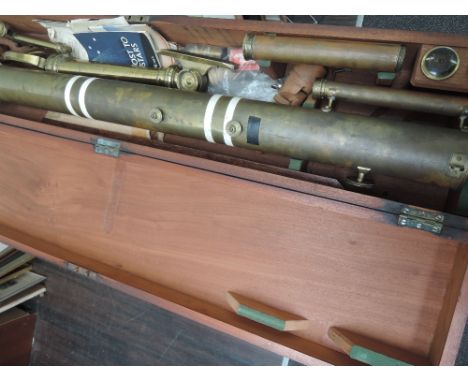 A vintage brass celestial telescope, with accessories including lenses, labelled John Browning, London, with a brass table to