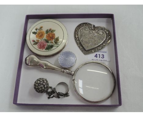 A small selection of HM silver items including a powder compact with enamelled chrysanthemum decoration, magnifying glass, pi