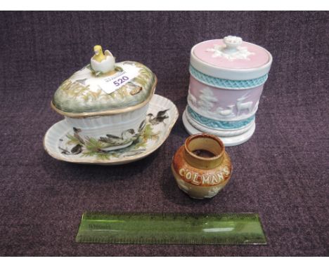 A 19th century Continental chocolate cup and saucer in the Meisen style having duck egg finish and black swan pictorial decor
