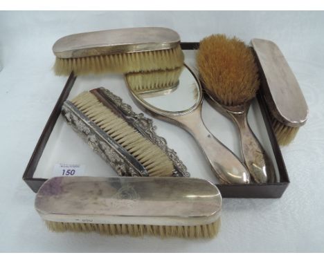 A three piece silver dressing table set of plain form having monogram to back, London 1916, Charles Henry Dumenil, another pa