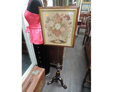 A 19th century part rosewood pole screen having inset floral tapestry screen on brass adjustable pillar and triple splay legs