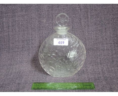 A French clear glass perfume bottle by Lalique having moulded flower decoration with etched marks and upper case R Lalique to