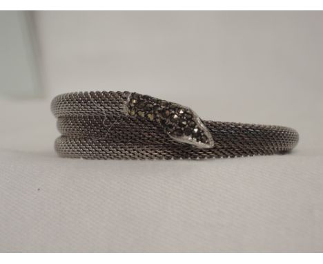 A white metal plaited snake bangle stamped Rhodium having marcasite decoration to head