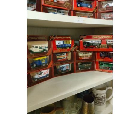 Shelf of matchbox yesteryear advertising van models etc. 