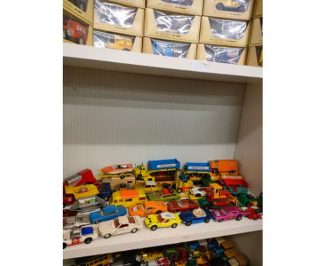 Shelf of playworn vehicles includes dinky and match box . 