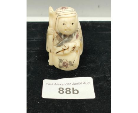 Chinese traveller netsuke signed to base. 